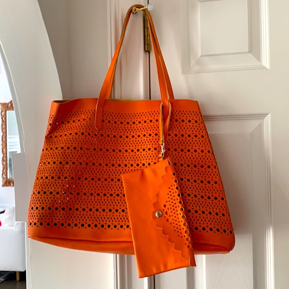 Saks Fifth Avenue Handbags - Saks Fifth Avenue’s Tote and Wallet Perforated Orange  vegan leather EUC